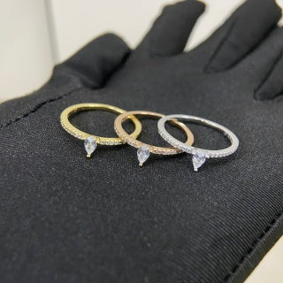 Cartier ring with a pear-shaped diamond center stone and diamond accents